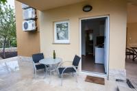 Televízia a/alebo spoločenská miestnosť v ubytovaní Apartments Laura