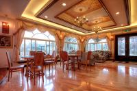a room with a dining room with tables and chairs at Aurora in Wujie