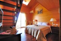 a bedroom with a bed in a wooden room at Aurora in Wujie