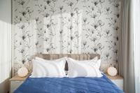 Asian Magnolia Boutique Apartmentsにあるベッド