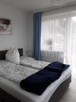 A bed or beds in a room at Gasthof Steiner