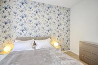 Asian Magnolia Boutique Apartmentsにあるベッド
