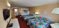 Ein Bett oder Betten in einem Zimmer der Unterkunft Shangri-La Motel