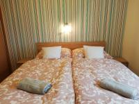 Posteľ alebo postele v izbe v ubytovaní Boroka Apartman
