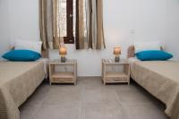 Łóżko lub łóżka w pokoju w obiekcie Villa Aloni in Triopetra