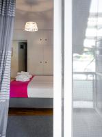 A bed or beds in a room at Unique apartment in Glyfada center