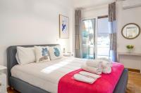 A bed or beds in a room at Unique apartment in Glyfada center