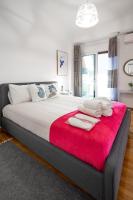 A bed or beds in a room at Unique apartment in Glyfada center