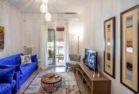 A television and/or entertainment centre at Unique apartment in Glyfada center