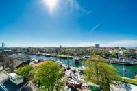 a view of a harbor with boats in the water at WIROtel Warnemünde in Warnemünde