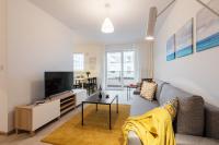 Televízia a/alebo spoločenská miestnosť v ubytovaní P&O Corporate Serviced Apartments Cybernetyki