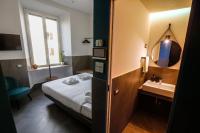 Posteľ alebo postele v izbe v ubytovaní Ottaviano Smart Rooms