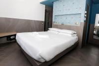 Posteľ alebo postele v izbe v ubytovaní Ottaviano Smart Rooms
