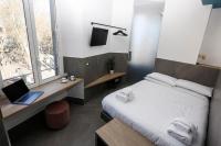 Posteľ alebo postele v izbe v ubytovaní Ottaviano Smart Rooms