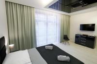 Postel nebo postele na pokoji v ubytování Prestige Apartamenty VINCI Centrum