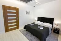 Postel nebo postele na pokoji v ubytování Prestige Apartamenty VINCI Centrum