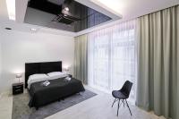 Postel nebo postele na pokoji v ubytování Prestige Apartamenty VINCI Centrum