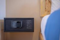 a phone on the wall of a room at Paretto Seaview Hotel in Pantai Cenang