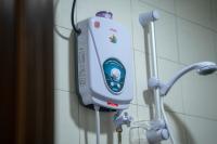 a soap dispenser is hanging on a wall at Paretto Seaview Hotel in Pantai Cenang