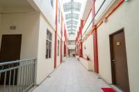 an empty hallway in an office building with a ceiling at Paretto Seaview Hotel in Pantai Cenang
