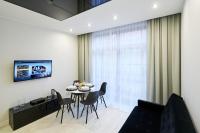 TV a/nebo společenská místnost v ubytování Prestige Apartamenty VINCI Centrum