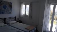 Postel nebo postele na pokoji v ubytování Isidoros Apartments