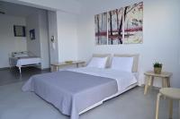 Postel nebo postele na pokoji v ubytování Isidoros Apartments