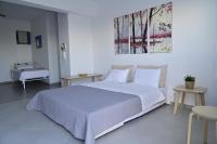 Postel nebo postele na pokoji v ubytování Isidoros Apartments