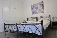 Postel nebo postele na pokoji v ubytování Isidoros Apartments