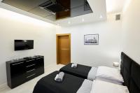 Postel nebo postele na pokoji v ubytování Prestige Apartamenty VINCI Centrum