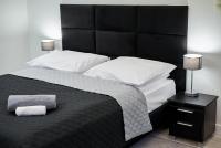 Postel nebo postele na pokoji v ubytování Prestige Apartamenty VINCI Centrum