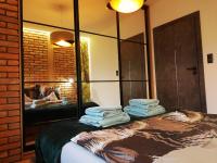 Posteľ alebo postele v izbe v ubytovaní Apartament na Mazurach