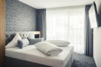 A bed or beds in a room at Panorama Residence Mösern