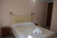 Postel nebo postele na pokoji v ubytování Hotel Doña Carmen