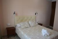 Postel nebo postele na pokoji v ubytování Hotel Doña Carmen