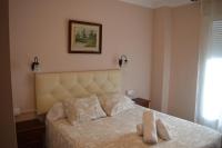 Postel nebo postele na pokoji v ubytování Hotel Doña Carmen