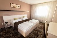 Łóżko lub łóżka w pokoju w obiekcie Parkhotel Plzen Congress Center