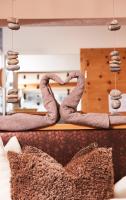 a pair of snakes sitting on top of a bed at Hundehotel Riederhof in Ried im Oberinntal