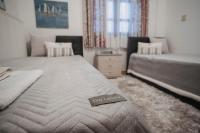 A bed or beds in a room at Mythic House