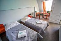 Posteľ alebo postele v izbe v ubytovaní Hotel Karolinka
