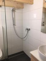 a bathroom with a shower and a sink at Serviced Apartement Sonnleitner in Furth