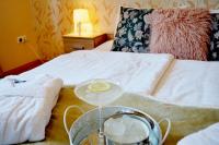Posteľ alebo postele v izbe v ubytovaní Gyula Wellness Villa