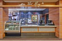 a fast food restaurant with a sign on the shop at Crowne Plaza Chicago O'Hare Hotel & Conference Center by IHG in Rosemont