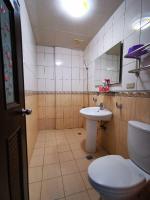 a bathroom with a toilet and a sink at Rihchun Homestay in Hengchun South Gate