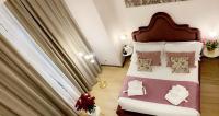 Postel nebo postele na pokoji v ubytování INTOMILAN Galleria Duomo I Boutique & Design Aparthotel