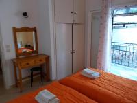 Postel nebo postele na pokoji v ubytování Eva Apartments