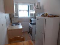 Kuchyň nebo kuchyňský kout v ubytování Eva Apartments