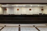 a waiting room with a long counter and chairs at Crowne Plaza Chicago O'Hare Hotel & Conference Center by IHG in Rosemont