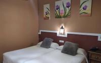 Posteľ alebo postele v izbe v ubytovaní Hotel Sierra de Araceli Lucena