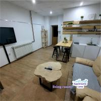 a living room with a couch and a table at Apartment Lena Centar - best value, best choice! in Osijek